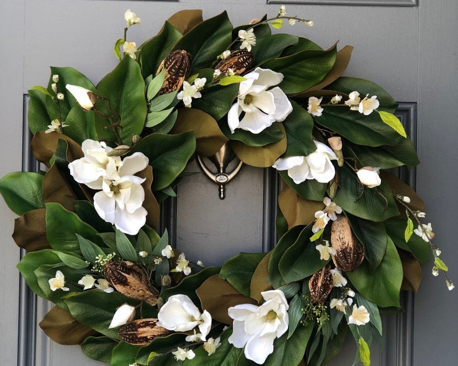 Magnolia wreath for front door with realistic white magnolia blooms nestled in green magnolia leaves with pods
