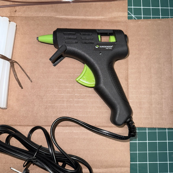 A Surebonder Hight Temp Hot Melt Glue Gun for mini sticks.