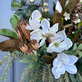 Basket for front door with magnolia florals and greenery with natural branches and pods 24