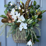 Basket for front door with magnolia florals and greenery with natural branches and pods 24