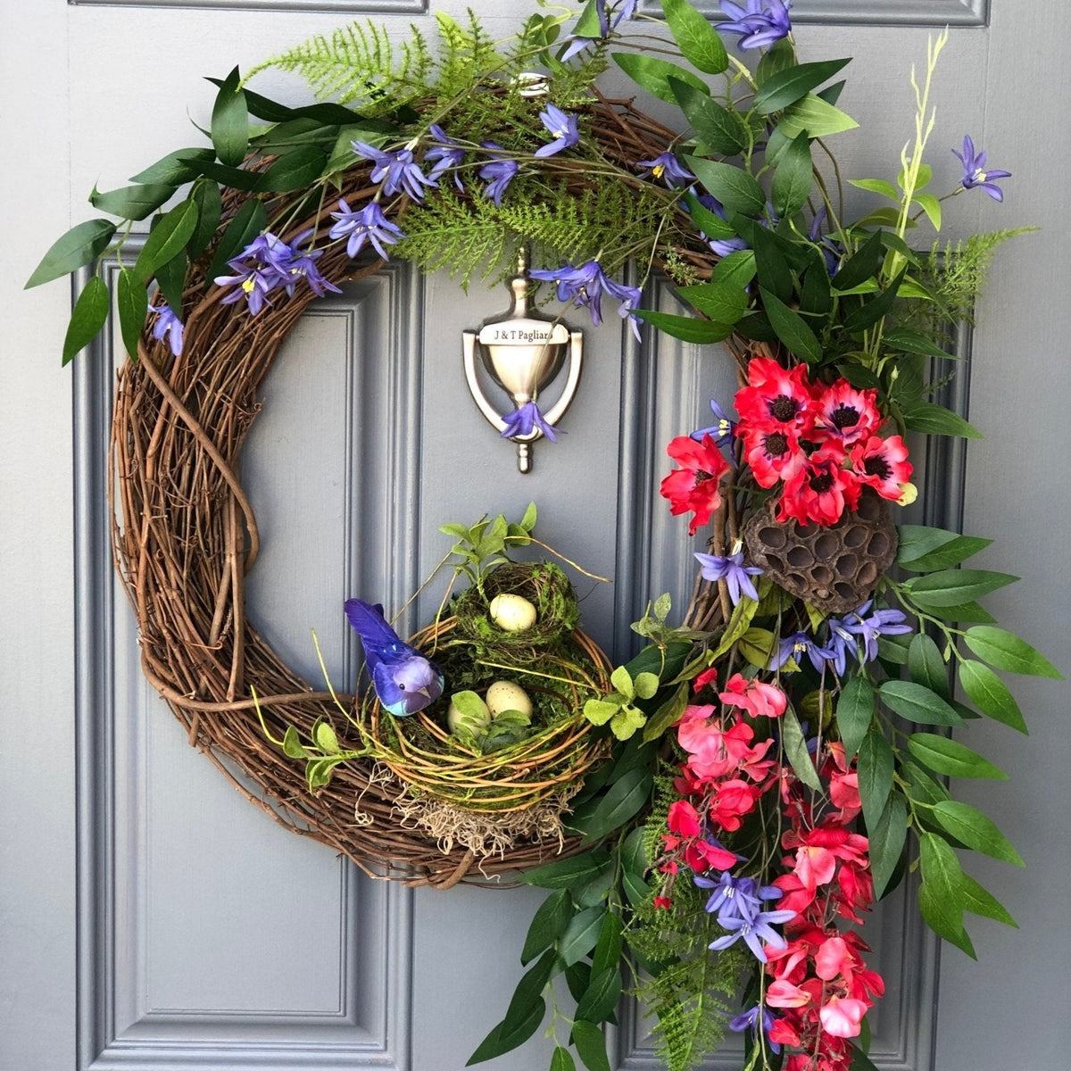 Bird Lover's Wreath, Deep Red and Brilliant Blues with two Nests and Lush Greenery. 20 inch diameter.