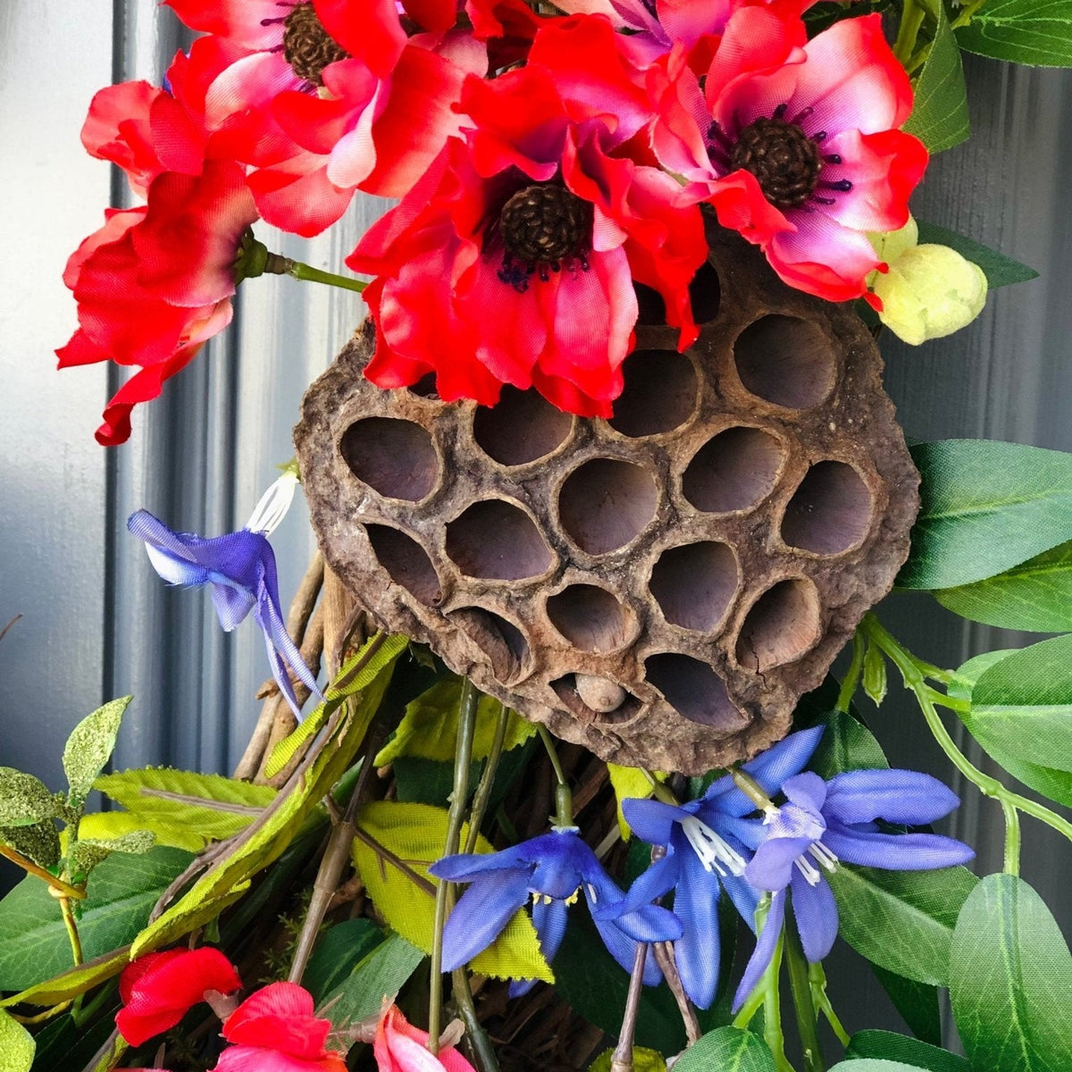 Bird Lover's Wreath, Deep Red and Brilliant Blues with two Nests and Lush Greenery. 20 inch diameter.