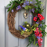 Bird Lover's Wreath, Deep Red and Brilliant Blues with two Nests and Lush Greenery. 20 inch diameter.