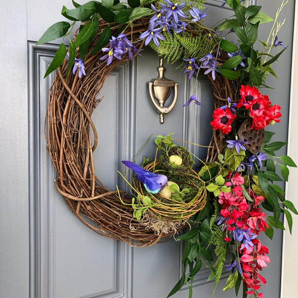 Bird Lover's Wreath, Deep Red and Brilliant Blues with two Nests and Lush Greenery. 20 inch diameter.