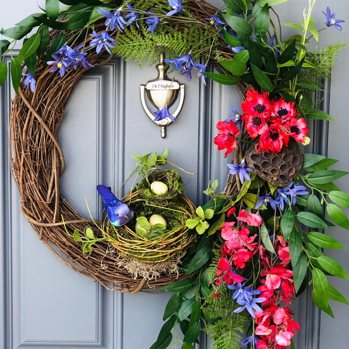 Bird Lover's Wreath, Deep Red and Brilliant Blues with two Nests and Lush Greenery. 20 inch diameter.