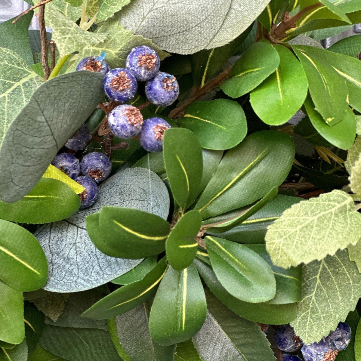 Evergreen and blueberry wreath