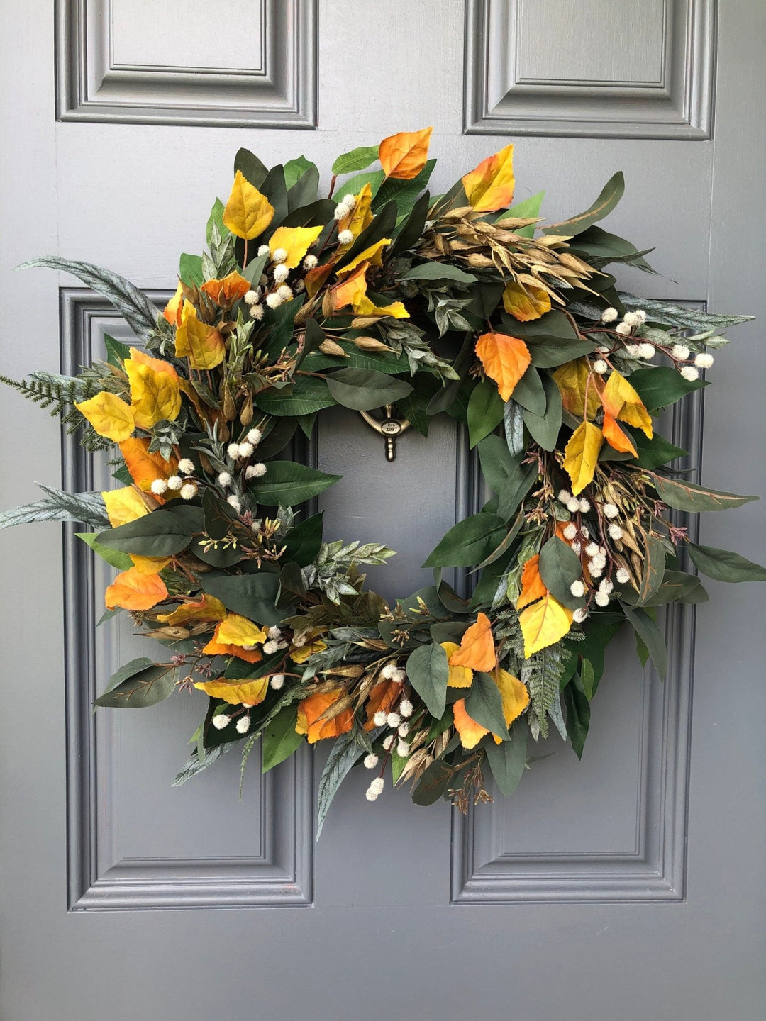 Fall eucalyptus greenery wreath with birch leaves, seeded pods and pussy willow.