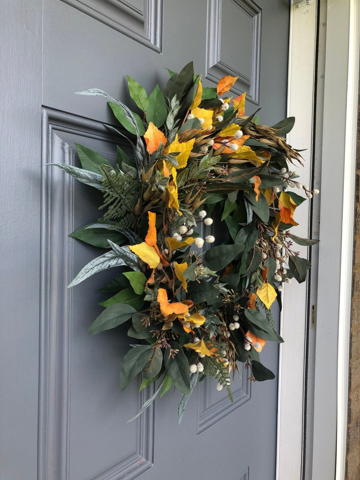 Fall eucalyptus greenery wreath with birch leaves, seeded pods and pussy willow.