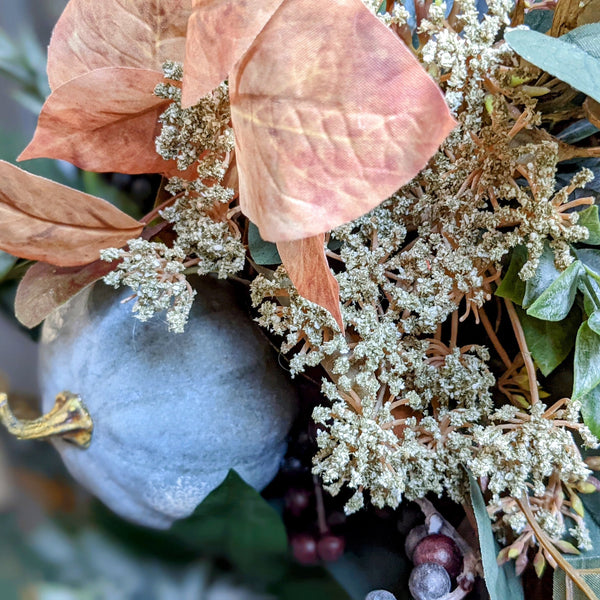 Close up image showing the blue pumpkin and the eucalyptus