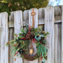 Christmas wreath, Pine wreath with red berries and brass bell. Faux natural looking design for entire winter season. Holiday decorating