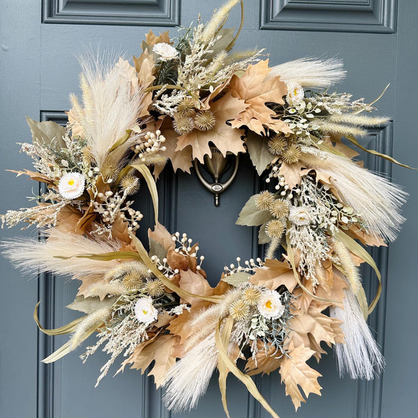 Boho wreath with beige oak leaves, ivory pampas grass, small straw flowers, pods and berries add so much texture to this beautful design. Comes im two sizes 20&quot; and 24&quot;