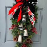 Christmas front door swag with Silver metal bells. Mixed pine with natural pinecones and red berries with twigs topped with a stunning bow!