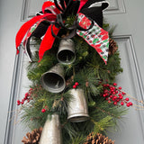 Christmas front door swag with Silver metal bells. Mixed pine with natural pinecones and red berries with twigs topped with a stunning bow!