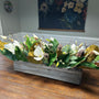 This is a faux table arrangement with a 20&quot;x4&quot;x4&quot; wooden box. Filled with green and brown magnolia leaves, ivory magnolia flowers, brown natural pods with eucalyptus, ivory cherry blosssoms and natural branches. Beautiful farmhouse style arrangement.