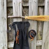 Primitive witch halloween wreath, 22”wide x 24” in length, hand sewn witch outfit hung on her broom, handcrafted witch decor, witchcraft