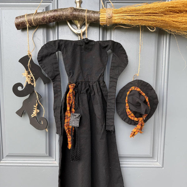 Primitive witch halloween wreath, 22”wide x 24” in length, hand sewn witch outfit hung on her broom, handcrafted witch decor, witchcraft