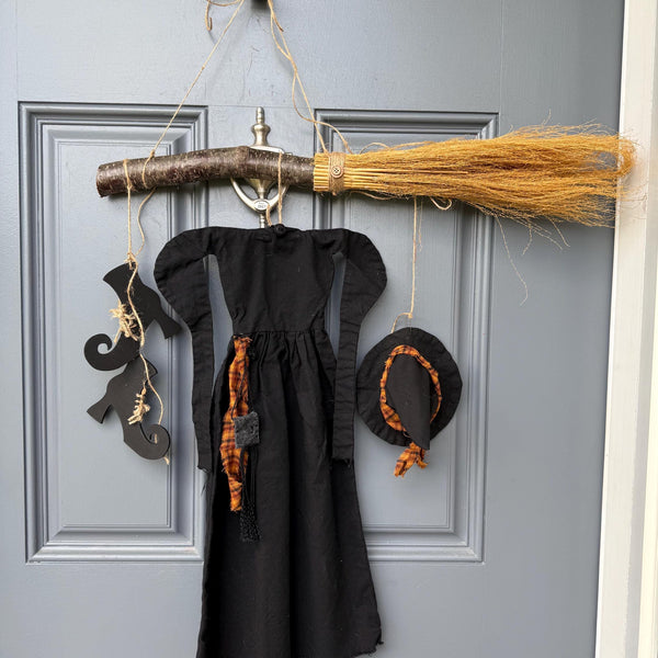 Primitive witch halloween wreath, 22”wide x 24” in length, hand sewn witch outfit hung on her broom, handcrafted witch decor, witchcraft