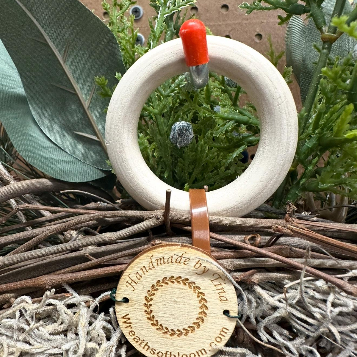 Christmas wreath, Pine wreath with red berries and brass bell. Faux natural looking design for entire winter season. Holiday decorating