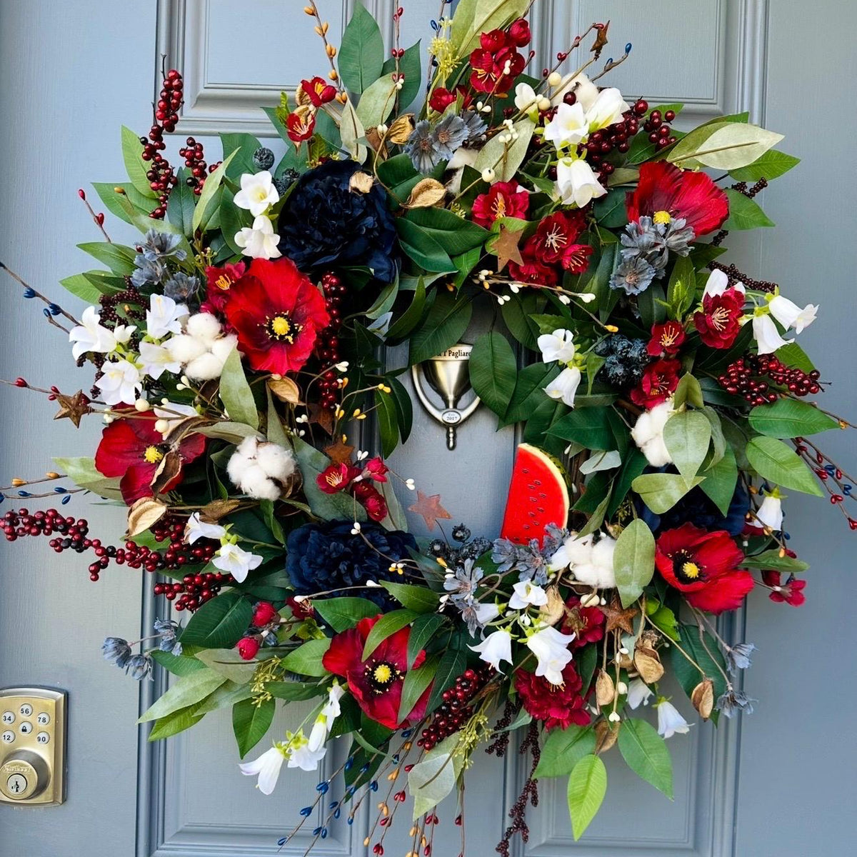 Summer americana wreath for front door, red, white and blue flowers with cotton, and berries for texture. Love the adorable watermelon wedge