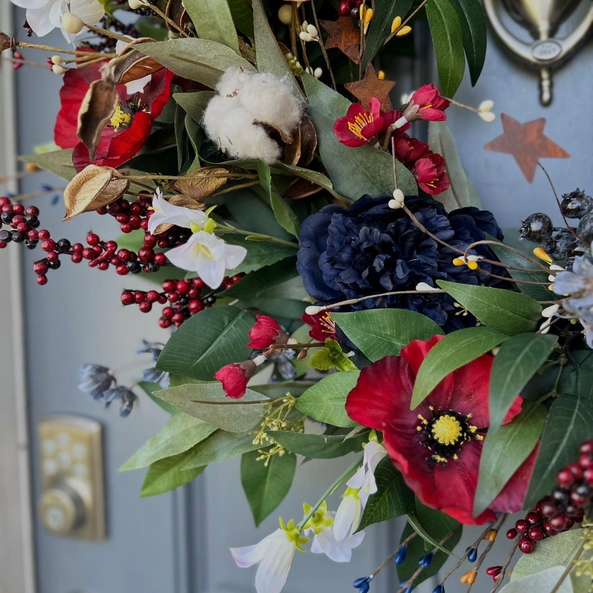 Summer americana wreath for front door, red, white and blue flowers with cotton, and berries for texture. Love the adorable watermelon wedge