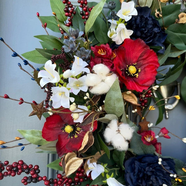 Summer americana wreath for front door, red, white and blue flowers with cotton, and berries for texture. Love the adorable watermelon wedge