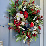 Summer americana wreath for front door, red, white and blue flowers with cotton, and berries for texture. Love the adorable watermelon wedge