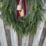 Norfolk pine front door wreath with brass bells