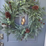 Winter front door wreath with brass bells