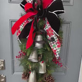 Christmas front door swag with Silver metal bells. Mixed pine with natural pinecones and red berries with twigs topped with a stunning bow!