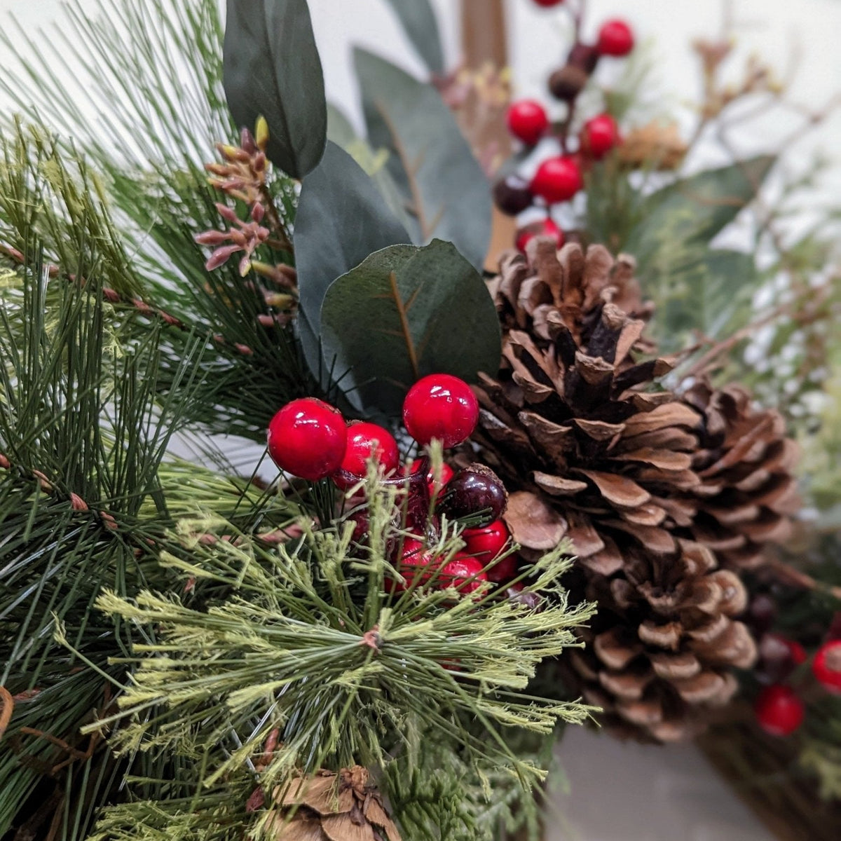 Rustic holiday winter wreath with brass bell. Faux natural wreath for entire season. This quaint wreath is perfect to welcome your guests!