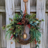 Rustic holiday winter wreath with brass bell. Faux natural wreath for entire season. This quaint wreath is perfect to welcome your guests!