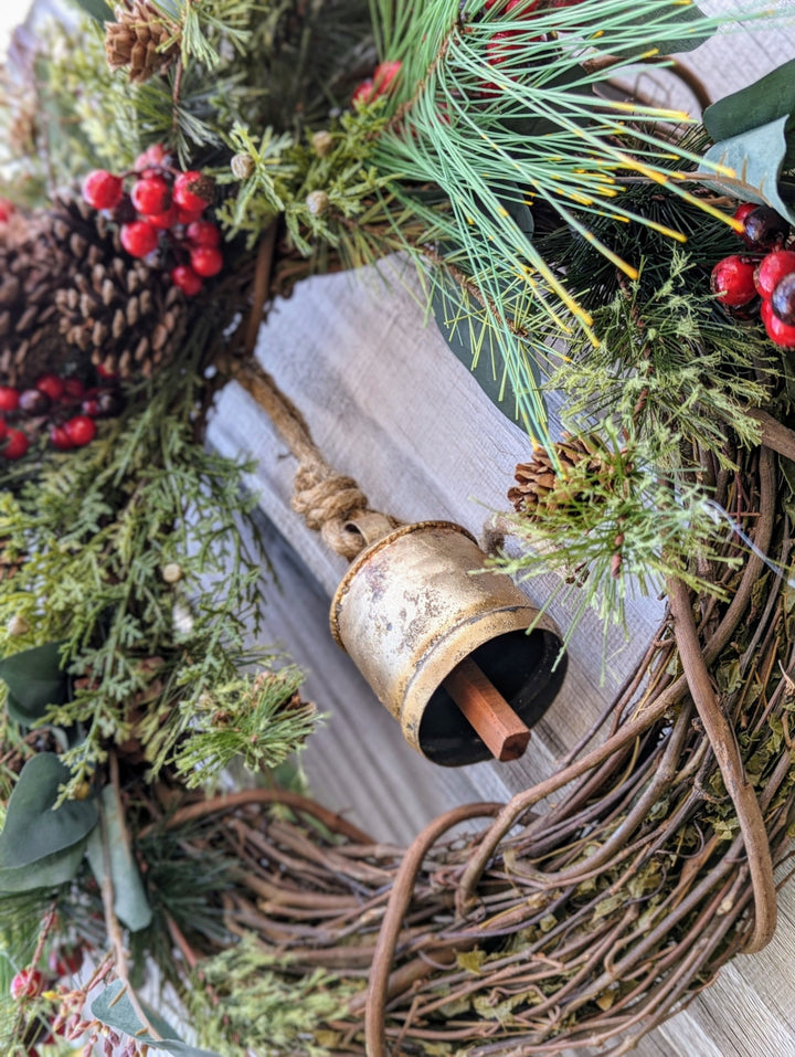 Rustic holiday winter wreath with brass bell. Faux natural wreath for entire season. This quaint wreath is perfect to welcome your guests!